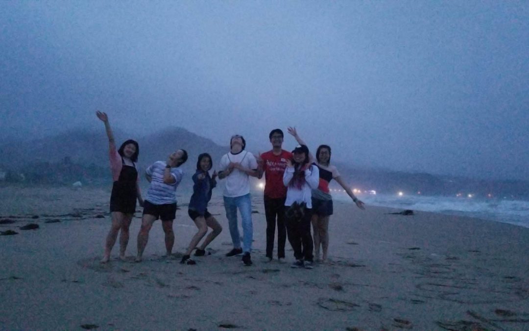 Olivia and friends on the beach in Korea