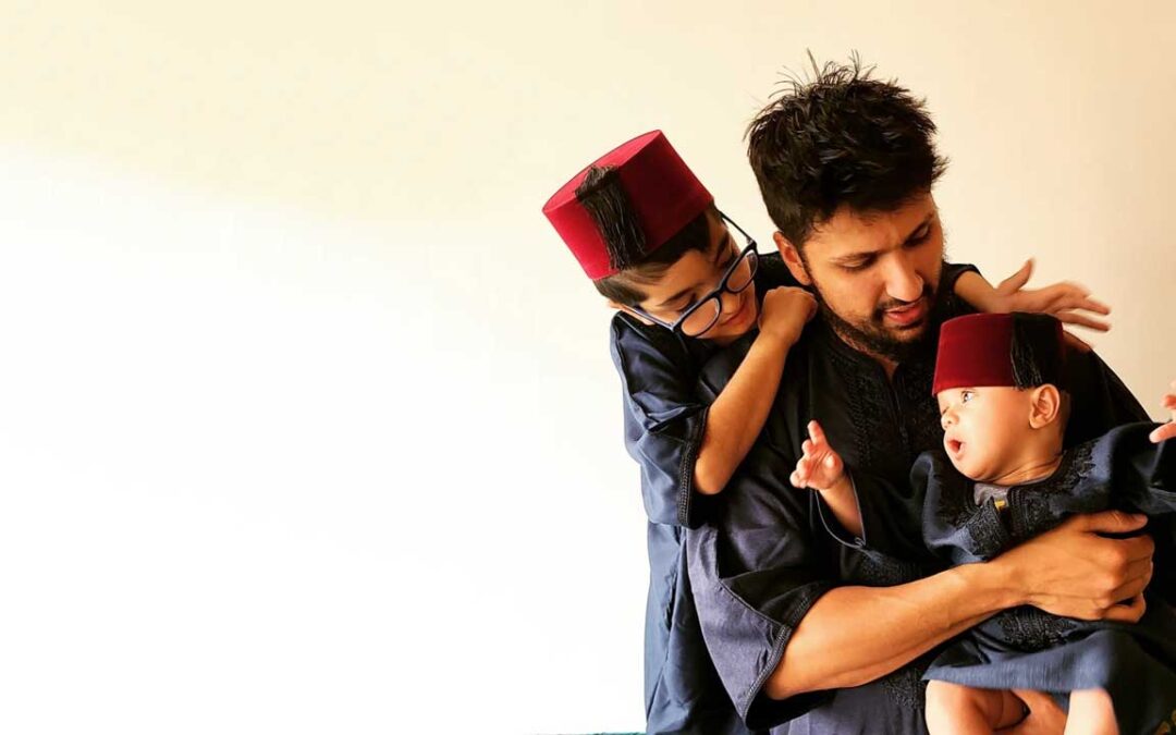 Muslim father with two young sons